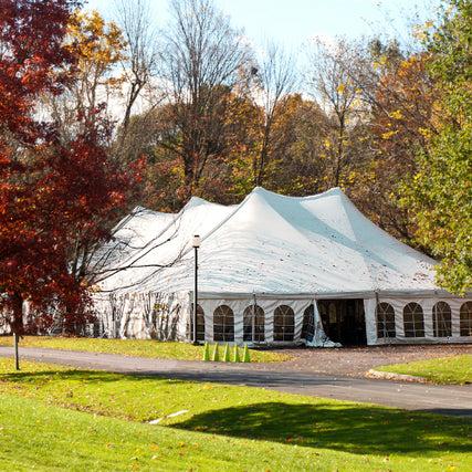 Party & EventA white event tent set up outside on a clear day.