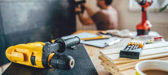 Various power tools spread across a table.
