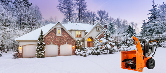Charming snow-covered house with warm lights, surrounded by frosty trees under a purple sky. An orange snowblower stands ready in the foreground.